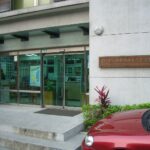 People read and study quietly inside a public library reading room.