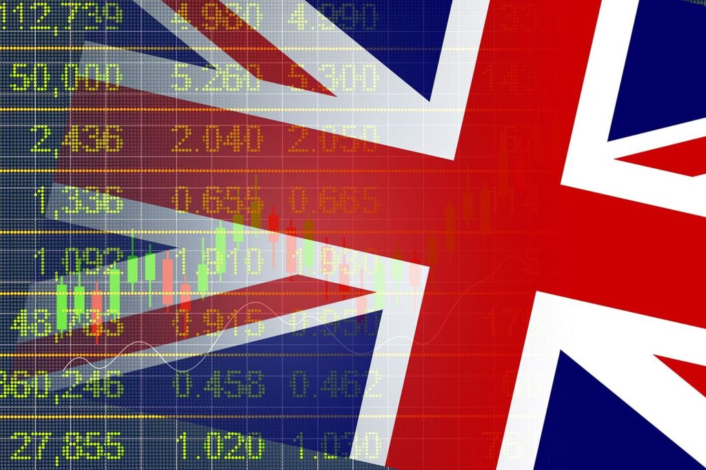 Multiple stock market trading screens displaying charts, prices and financial data in a trading room.