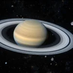 Stacked deep space images revealing faint moons around the planet Saturn