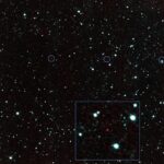 dark rocky asteroid floating against a background of stars